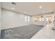 Spacious living room with plush gray carpeting and lots of natural light at 3605 Sapphire Sea Ct, North Las Vegas, NV 89031