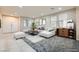 Bright living room features a comfortable sectional sofa and stylish decor at 3605 Sapphire Sea Ct, North Las Vegas, NV 89031