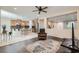 Open concept living space featuring a kitchen with an island and a living room with hardwood floors at 3605 Sapphire Sea Ct, North Las Vegas, NV 89031