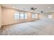 Large loft area featuring neutral carpeting, ceiling fans, and lots of natural light at 3605 Sapphire Sea Ct, North Las Vegas, NV 89031