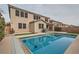 Backyard pool and jacuzzi are surrounded by lush landscaping and a two story home at 3605 Sapphire Sea Ct, North Las Vegas, NV 89031