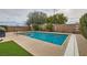 Inviting backyard pool with mature trees, and ample deck space for entertaining at 3605 Sapphire Sea Ct, North Las Vegas, NV 89031