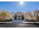 Beautiful two-story home boasting a manicured lawn, symmetrical design, and inviting curb appeal at 8109 Dark Hollow Pl, Las Vegas, NV 89117