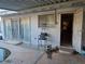 Exterior view of a covered backyard patio with metal security features, requiring maintenance and cleaning at 1552 Dorothy Ave, Las Vegas, NV 89119