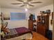 Bedroom with wood floors, ceiling fan, and closet at 1552 Dorothy Ave, Las Vegas, NV 89119