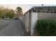 View of the backyard fence needing repair, running along the alleyway with street access at 1552 Dorothy Ave, Las Vegas, NV 89119