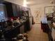 Picture of a kitchen with tile floors, dark cabinets and lots of clutter at 1552 Dorothy Ave, Las Vegas, NV 89119