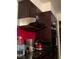Close-up of a kitchen with dark cabinets and modern appliances at 1552 Dorothy Ave, Las Vegas, NV 89119