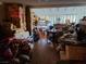 Untidy living room with hardwood floors, obstructed windows, and an open floor plan needs thorough cleaning at 1552 Dorothy Ave, Las Vegas, NV 89119