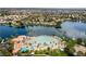 Aerial view of lakefront community with resort-style pool at 2628 Starfish Ct, Las Vegas, NV 89128