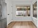 Bright breakfast nook with wood flooring and backyard view at 2628 Starfish Ct, Las Vegas, NV 89128