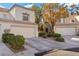 Two attached homes with two-car garages and landscaping at 2628 Starfish Ct, Las Vegas, NV 89128