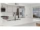 Modern kitchen with white cabinets, stainless steel appliances, and quartz countertops at 2628 Starfish Ct, Las Vegas, NV 89128