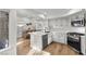 Updated kitchen featuring white cabinets, stainless steel appliances, and a large island at 2628 Starfish Ct, Las Vegas, NV 89128
