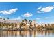 Community lakefront view with palm trees and buildings at 2628 Starfish Ct, Las Vegas, NV 89128