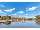 Scenic lakefront view with palm trees and mountains in background at 2628 Starfish Ct, Las Vegas, NV 89128