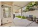 Covered patio with small grassy yard and seating area at 2628 Starfish Ct, Las Vegas, NV 89128