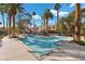 Community pool and spa area with palm trees at 2628 Starfish Ct, Las Vegas, NV 89128