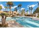 Sparkling community pool with palm trees and hot tub at 2628 Starfish Ct, Las Vegas, NV 89128