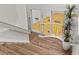 Indoor staircase with wood steps and railing, overlooking racquetball court at 2628 Starfish Ct, Las Vegas, NV 89128