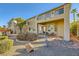Landscaped backyard with a patio and two-story home at 373 Via Sonador, Henderson, NV 89012