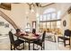 Spacious dining area with a large table and chairs, high ceilings, and elegant light fixture at 373 Via Sonador, Henderson, NV 89012