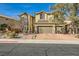 Two-story house with brick driveway and landscaping at 373 Via Sonador, Henderson, NV 89012