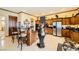 Island kitchen with breakfast bar, stainless steel appliances, and ample counter space at 373 Via Sonador, Henderson, NV 89012