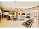 Relaxing living room with plush sofas, large windows, and a ceiling fan at 373 Via Sonador, Henderson, NV 89012