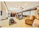 Spacious living room featuring comfortable seating and a view into the kitchen at 373 Via Sonador, Henderson, NV 89012