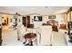 Bright main bedroom with two armchairs, fireplace, and large windows at 373 Via Sonador, Henderson, NV 89012