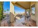Covered patio with seating area and view of the backyard at 373 Via Sonador, Henderson, NV 89012