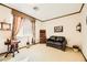 Charming sitting room with a leather couch and antique furniture at 373 Via Sonador, Henderson, NV 89012