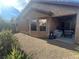 A home featuring an outdoor living space, private backyard, and low-maintenance landscaping at 4036 Shetland Pony St, Las Vegas, NV 89122