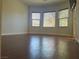 Bright bedroom features hardwood flooring and large windows at 4036 Shetland Pony St, Las Vegas, NV 89122
