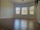 Bright bedroom features hardwood flooring and large windows at 4036 Shetland Pony St, Las Vegas, NV 89122