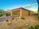 View of exterior with desert landscaping, driveway, and well-maintained facade at 4036 Shetland Pony St, Las Vegas, NV 89122