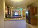 Open kitchen featuring granite countertops and stainless steel appliances at 4036 Shetland Pony St, Las Vegas, NV 89122