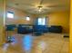 Spacious living room with neutral tile flooring and cozy seating area at 4036 Shetland Pony St, Las Vegas, NV 89122
