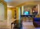 Inviting living area with tile floors, bar seating, and view to the kitchen at 4036 Shetland Pony St, Las Vegas, NV 89122