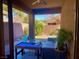 Relaxing covered patio with outdoor furniture and entertainment space overlooking the backyard at 4036 Shetland Pony St, Las Vegas, NV 89122