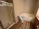 Bathroom with shower, tub, and wood vanity at 10550 W Alexander Rd # 2149, Las Vegas, NV 89129