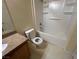 Clean bathroom with tub, shower, granite vanity, and toilet at 10550 W Alexander Rd # 2149, Las Vegas, NV 89129