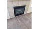 Gas fireplace with tile surround in living room at 10550 W Alexander Rd # 2149, Las Vegas, NV 89129