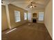 Bright living room featuring a fireplace and ceiling fan at 10550 W Alexander Rd # 2149, Las Vegas, NV 89129