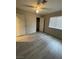 Bedroom with wood-look floors and a double-door closet at 2529 Rialto Rd, Las Vegas, NV 89108