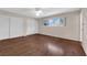 Spacious bedroom featuring laminate flooring, double door closet, and natural light at 3690 S Rosecrest Cir, Las Vegas, NV 89121