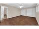 Bedroom featuring hard surface floors, white ceiling fan, and double sliding door closet at 3690 S Rosecrest Cir, Las Vegas, NV 89121