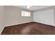 Bright bedroom featuring laminate flooring, double door closet, and natural light at 3690 S Rosecrest Cir, Las Vegas, NV 89121