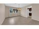 Bright dining area with stylish chandelier and views into the kitchen at 3690 S Rosecrest Cir, Las Vegas, NV 89121